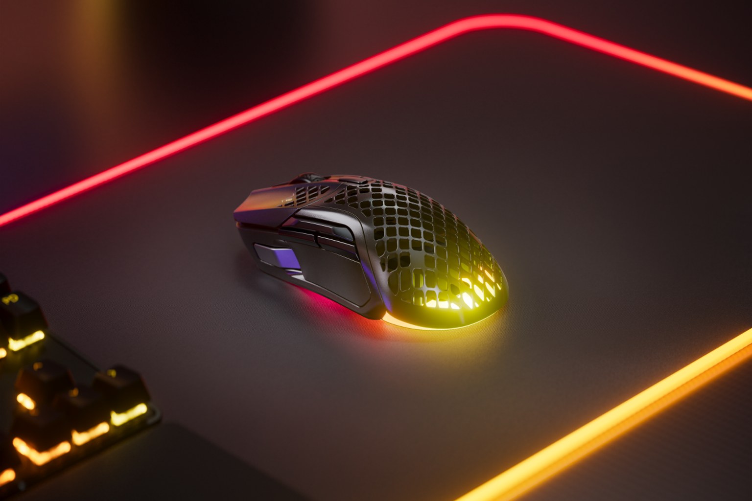 SteelSeries Aerox 5 Wireless gaming mouse in black with honeycomb shell and RGB lighting