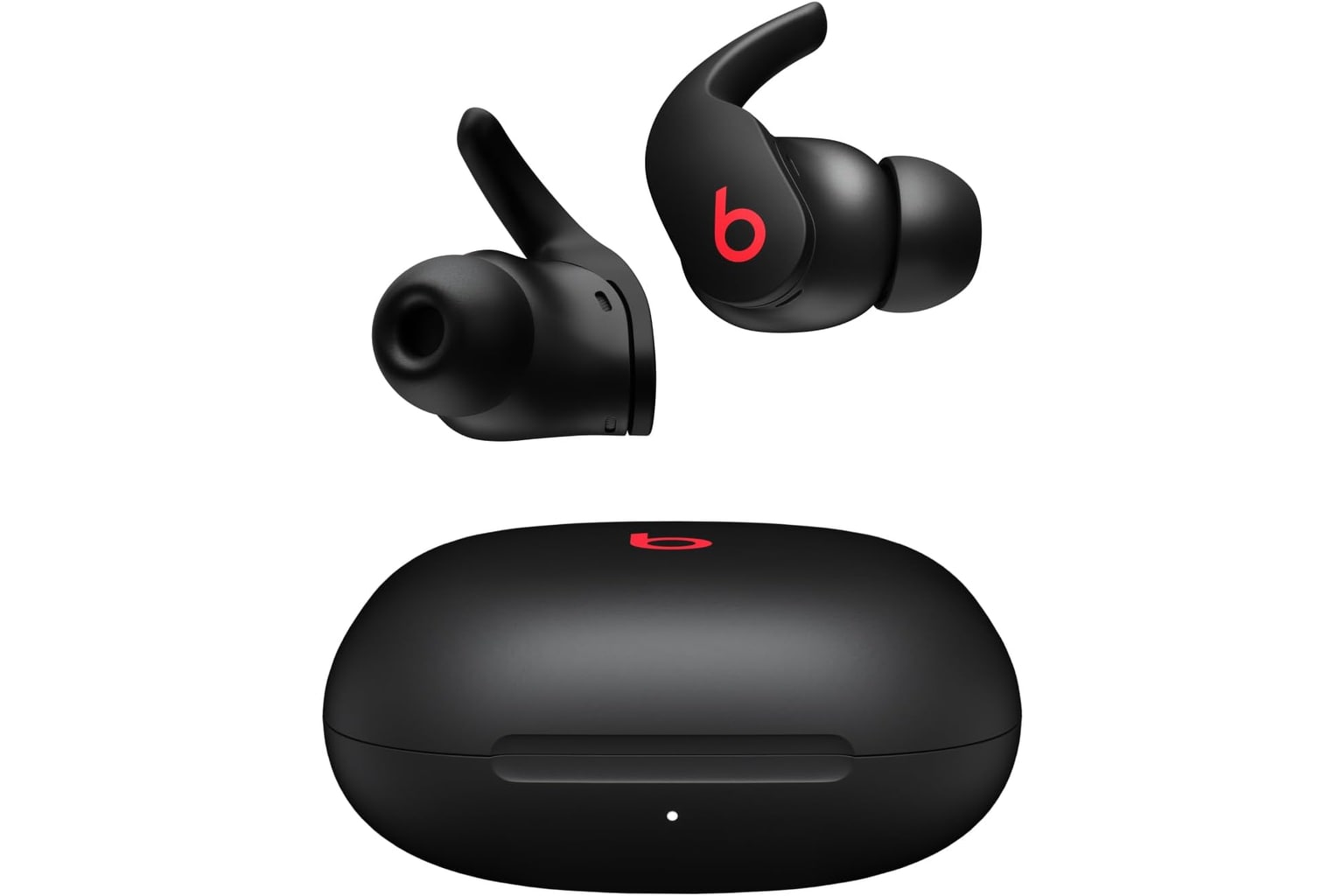 Black Beats Fit Pro earbuds with wingtips beside the black charging case.